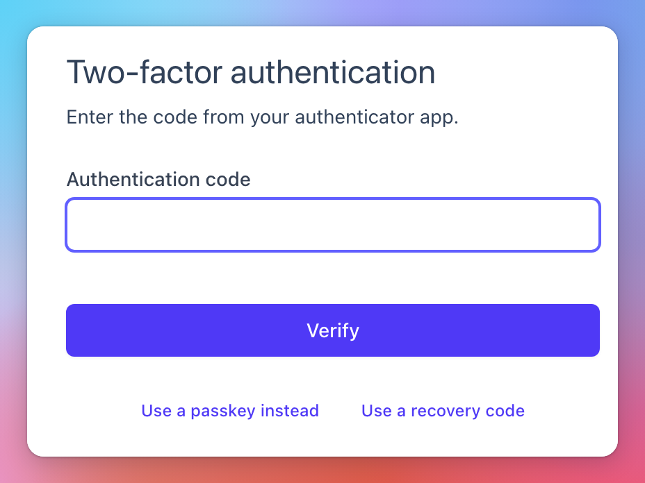 The second step of signing in, asking for the authentication code, with Use a passkey instead and Use a recovery code